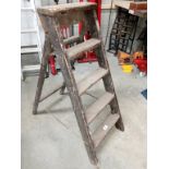 A five step wooden step ladder.