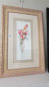 A framed and glazed print of tulips signed Rosalind Outhewaite.