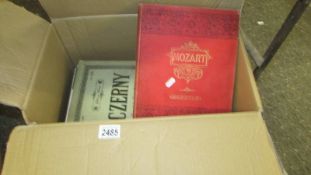 A box of various music books including Mozart.