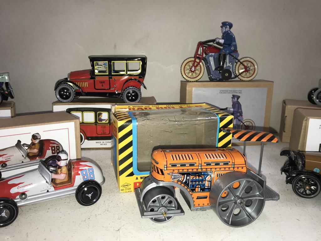 8 boxed re-issue tin plate clockwork toys including motorbikes, bus 7 taxi etc. - Image 3 of 4