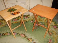 A painted fold up table and one other.