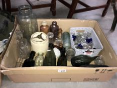 A quantity of glass bottles, vintage eye baths & tobacco jar etc.