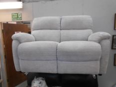 A cream 2 seater settee