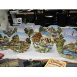 A set of 8 Royal Worcester canal scene collector's plates.