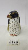 A Royal Crown Derby Rockhopper penguin with silver stopper.