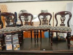 A set of 4 mahogany dining chairs.