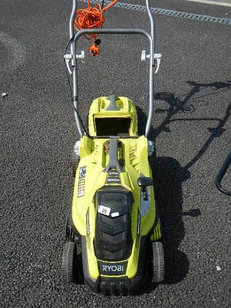 A Ryobi electric lawn mower.