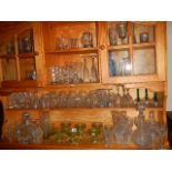 A large mixed lot of glass ware including decanters, vases etc.