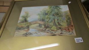 A gilt framed and glazed watercolour rural scene with bridge, signed Holinson 1922.