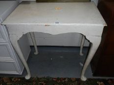 A painted side table on Queen Ann style legs.