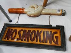 An unusual No Smoking sign featuring a knotted cigarette.