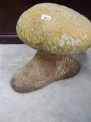 A mushroom shaped garden ornament.