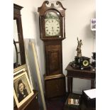 A grandfather clock for spares or repairs