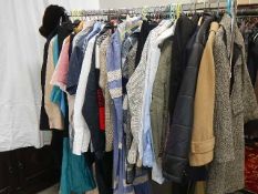 A rail of assorted clothing including coats, jackets, shirts etc., (some vintage).