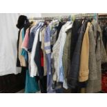 A rail of assorted clothing including coats, jackets, shirts etc., (some vintage).