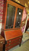 A mahogany inlaid bureau bookcase.