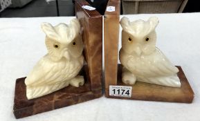 A pair of carved polished stone owl bookends