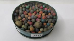 A large quantity of old clay marbles.