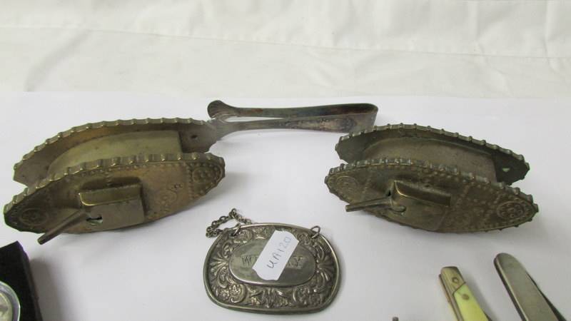 A mixed lot including 2 brass tanks, military badges, buttons, pen knives etc. - Image 2 of 4