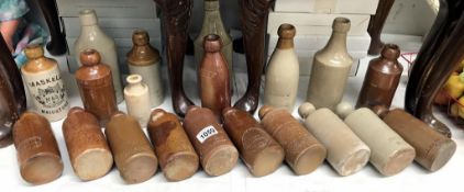 A good selection of stoneware ginger beer bottles, porters, etc,