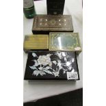 A lacquered box decorated with mother of pearl, 2 inlaid boxes and a brass box.