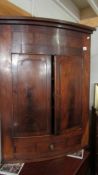 A Victorian mahogany corner cupboard, 111 x 82 cm.