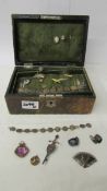 An old jewellery box containing silver and other jewellery,