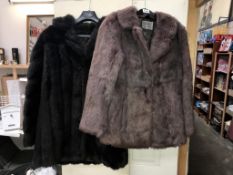 A coney fur coat and 1 other