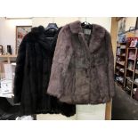 A coney fur coat and 1 other