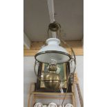 A hanging oil lamp converted to electric complete with shade and chimney.