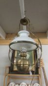 A hanging oil lamp converted to electric complete with shade and chimney.