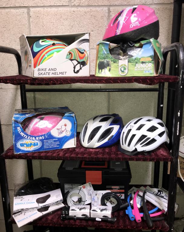 6 children's helmets (all appear new), quantity of high visibility vests, 2 saddle covers,