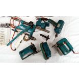 A large lot of vintage Black & Decker turquoise drills and attachments.