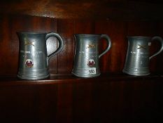 Three good pewter tankards.