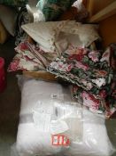 A box of assorted bed linen, curtains etc.