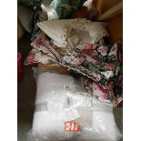 A box of assorted bed linen, curtains etc.