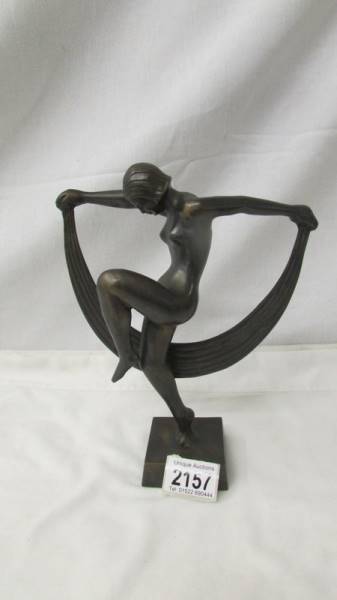 A contemporary bronze figure of a nude dancer, 24 cm tall.