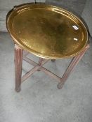 A brass topped table.