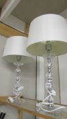 A pair of good quality modern table lamps with shades.