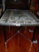 A retro table with map top.