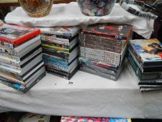 Approximately 60 DVD's etc.