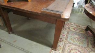 An oak extending dining table.