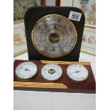 A slate barometer and another barometer.