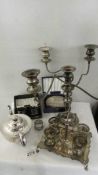 A mixed lot of silver plate including candelabra, teapot, egg cup stand, napkin rings etc.