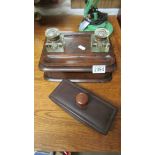 A Victorian mahogany inkstand with 2 glass inkwells and a modern desk blotter.
