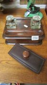 A Victorian mahogany inkstand with 2 glass inkwells and a modern desk blotter.