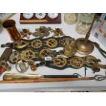 A mixed lot of brassware including horse brasses, scales, poker on stand etc.