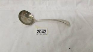 A hall marked silver ladle.