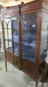 An Edwardian mahogany inlaid astragal glazed display cabinet (crack in one glass).