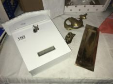 A brass letterbox,
